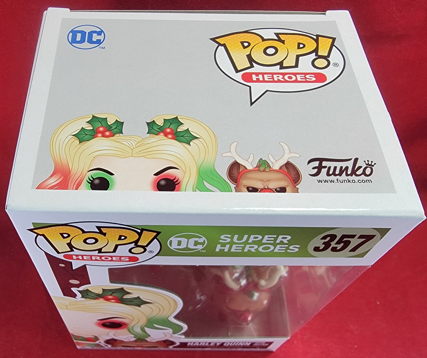 Harley quinn with helper funko # 357 (nib)
With pop protector