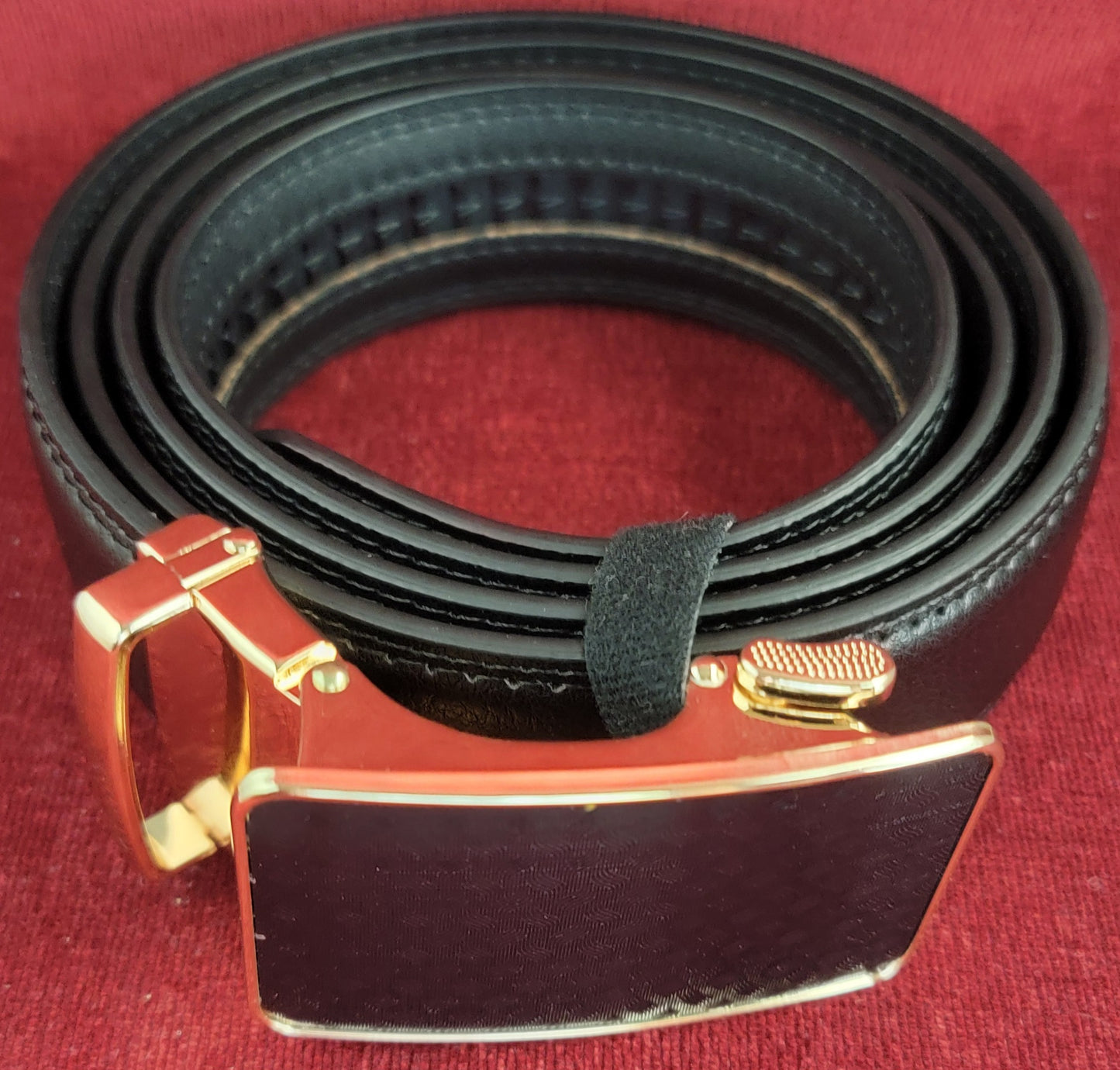 Black and gold ratchet belt