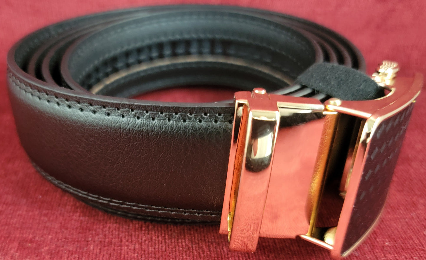 Black and gold ratchet belt
