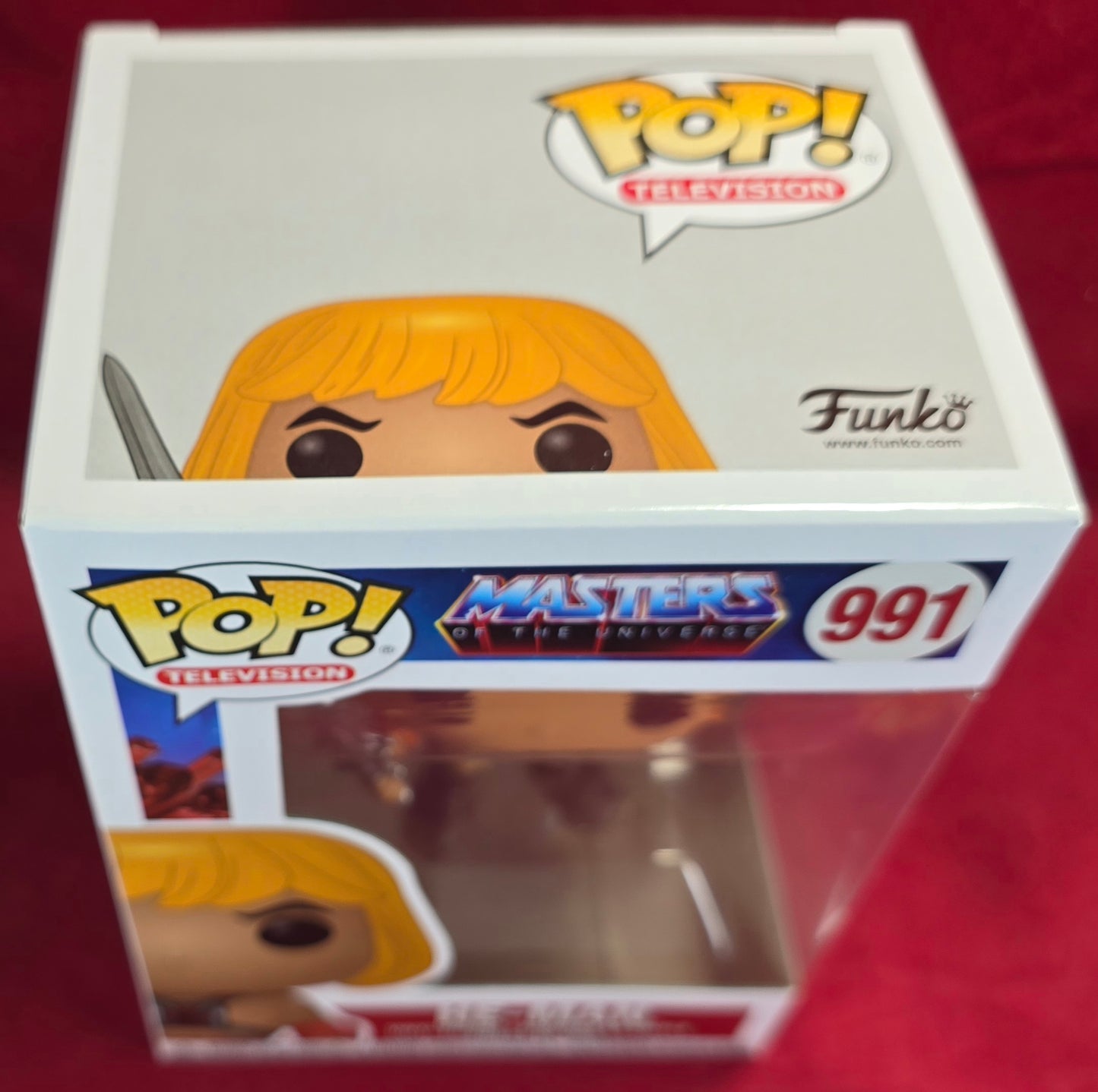 He-Man Funko #991 (Nib)
With pop protector